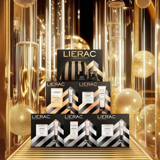 Cofanetti regalo Lierac con prodotti cosmetici esposti su sfondo dorato elegante